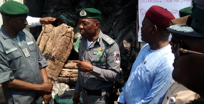 The Seme Customs boss showcasing the seized donkey skins